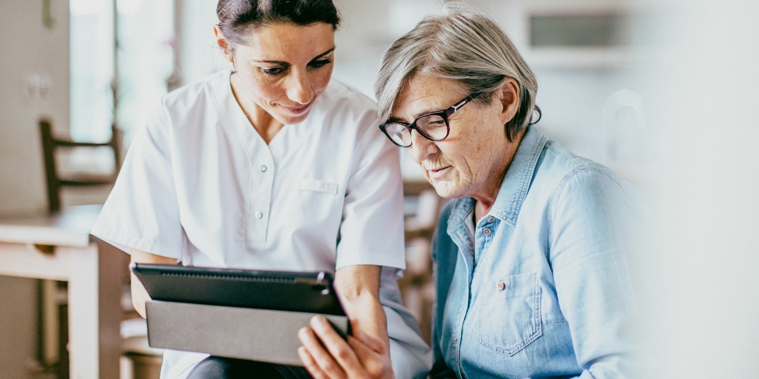 Caregiver with elderly patient.
